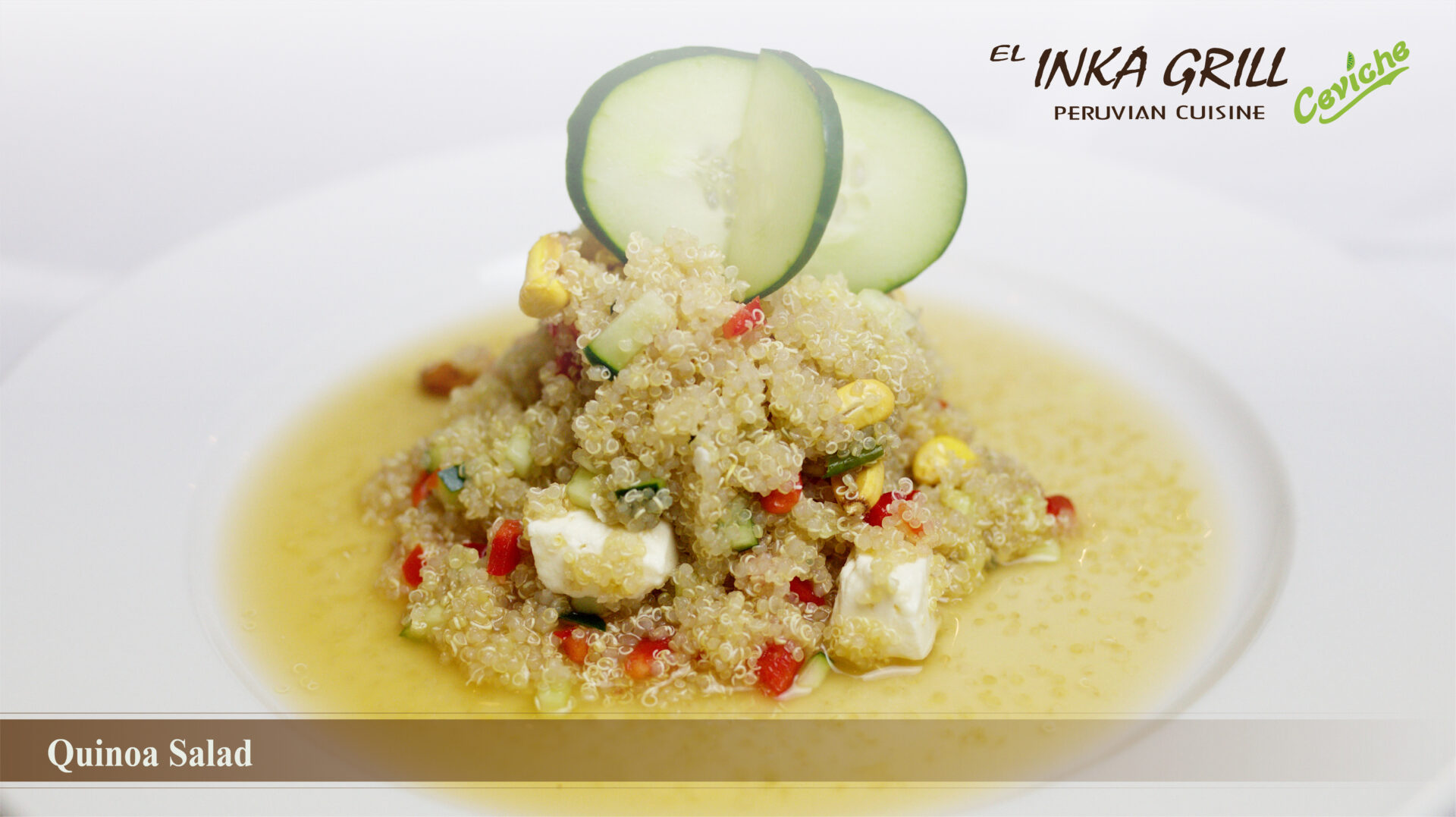 A white plate topped with food and some cucumber slices.