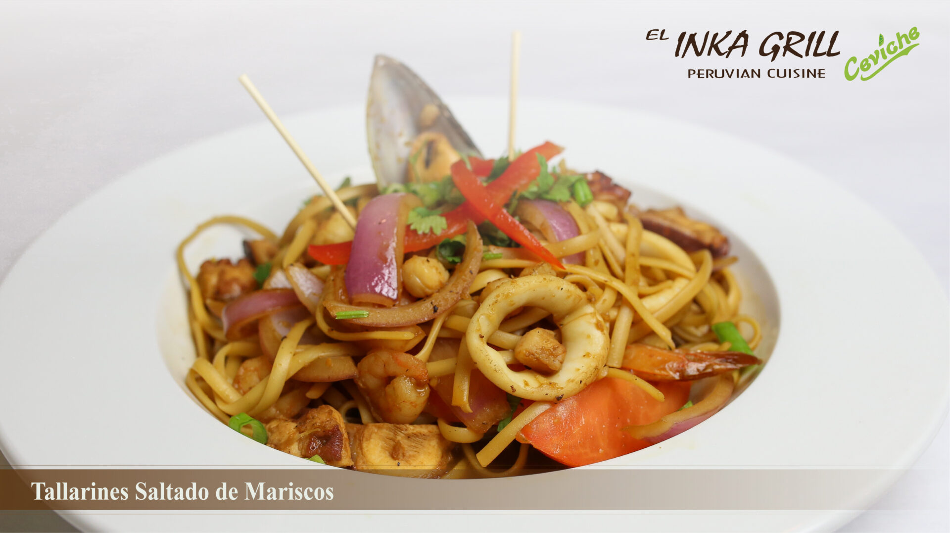 A plate of food with noodles and vegetables.