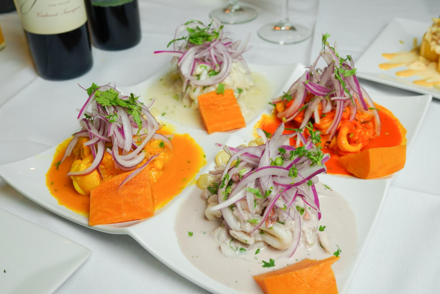 A plate of food with vegetables and cheese on it.