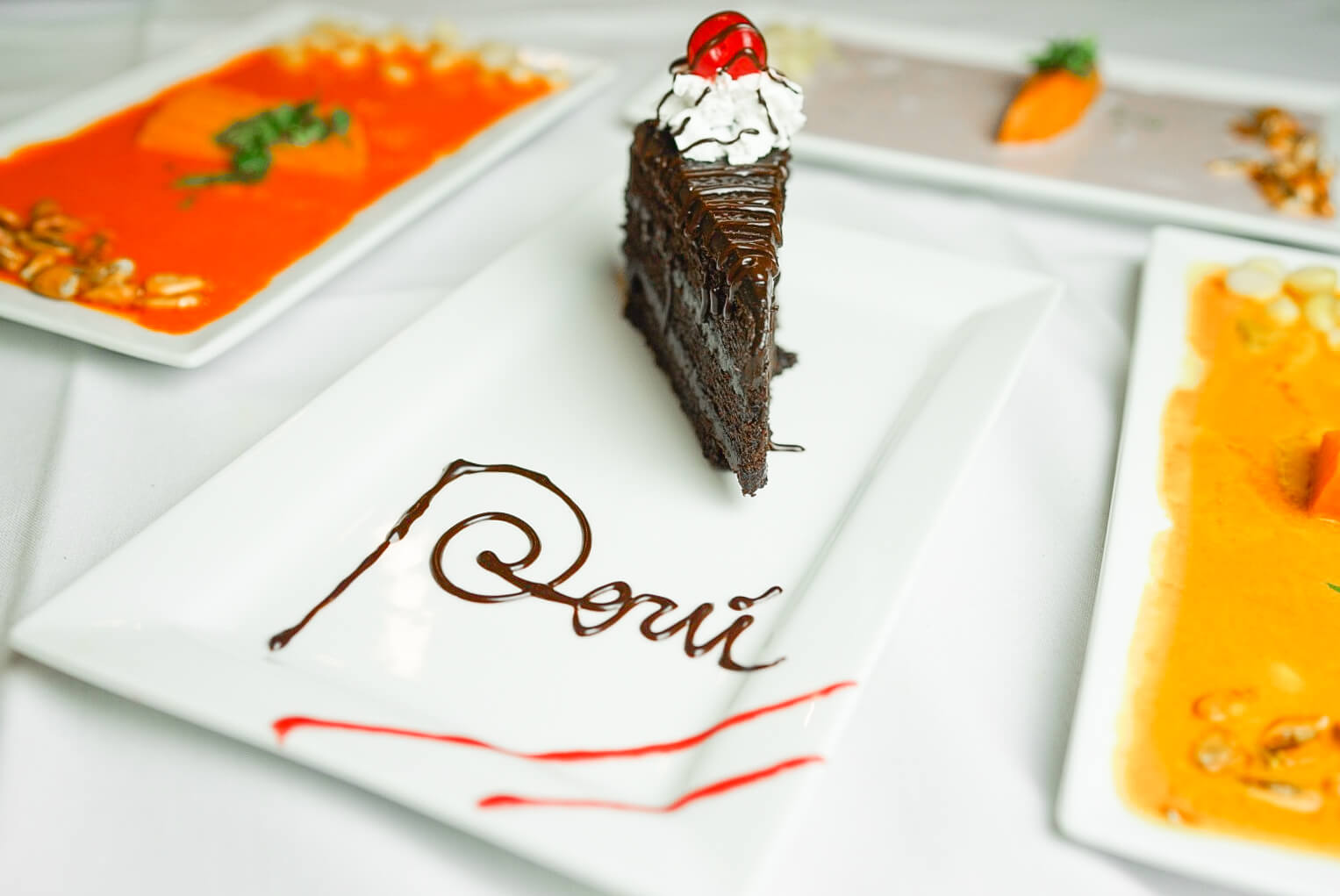 A piece of cake sitting on top of a white plate.