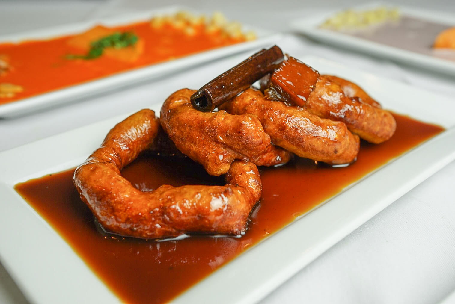 A plate of food with sausage and sauce on it.