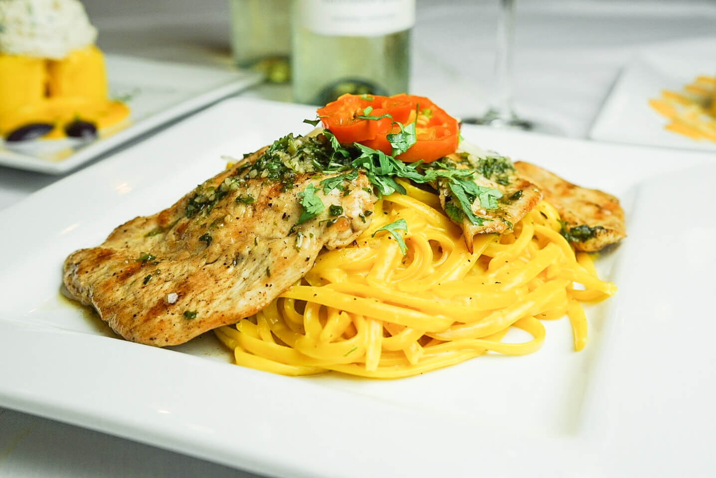 A plate of food with pasta and meat on it.