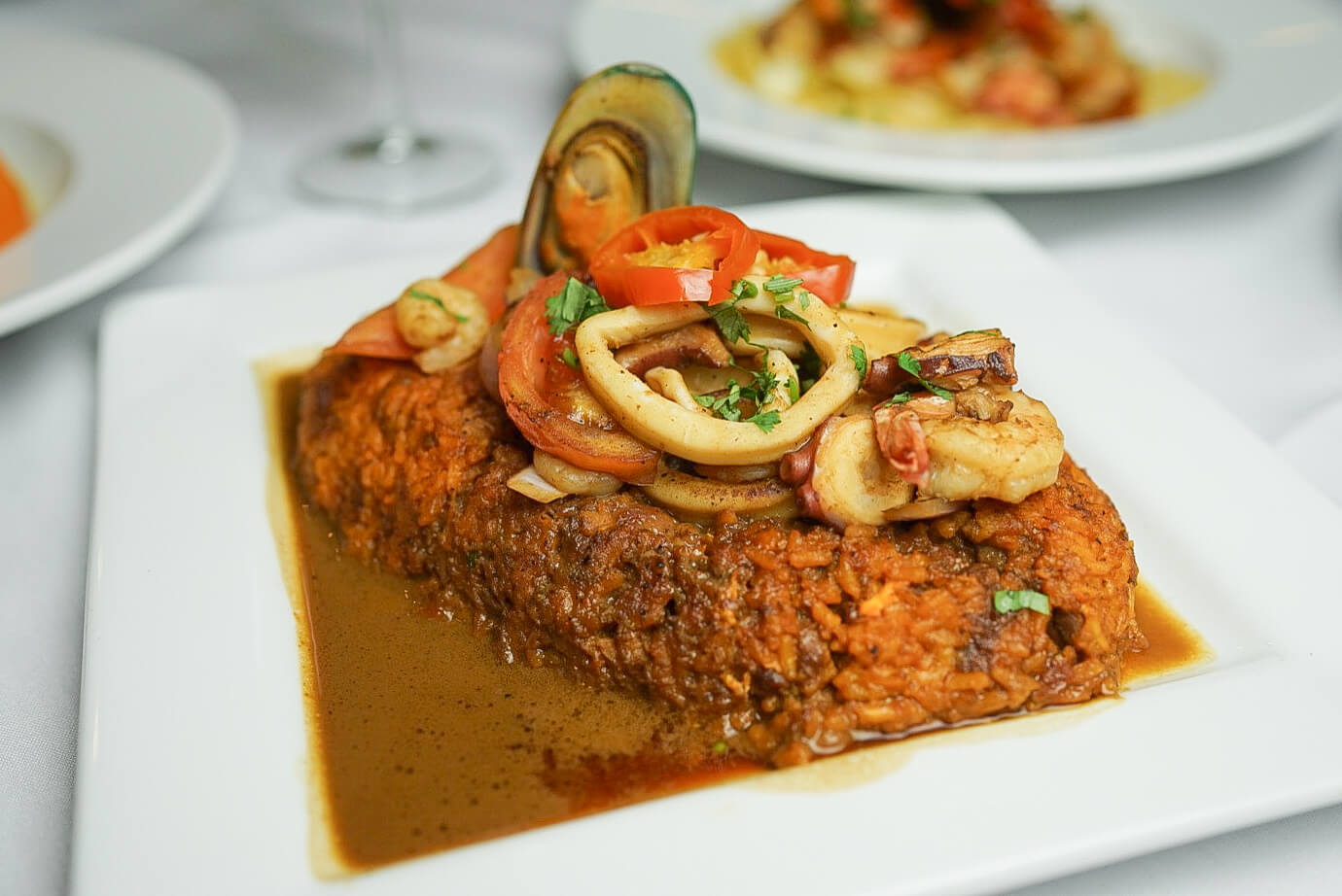 A plate of food with meat and vegetables on it.