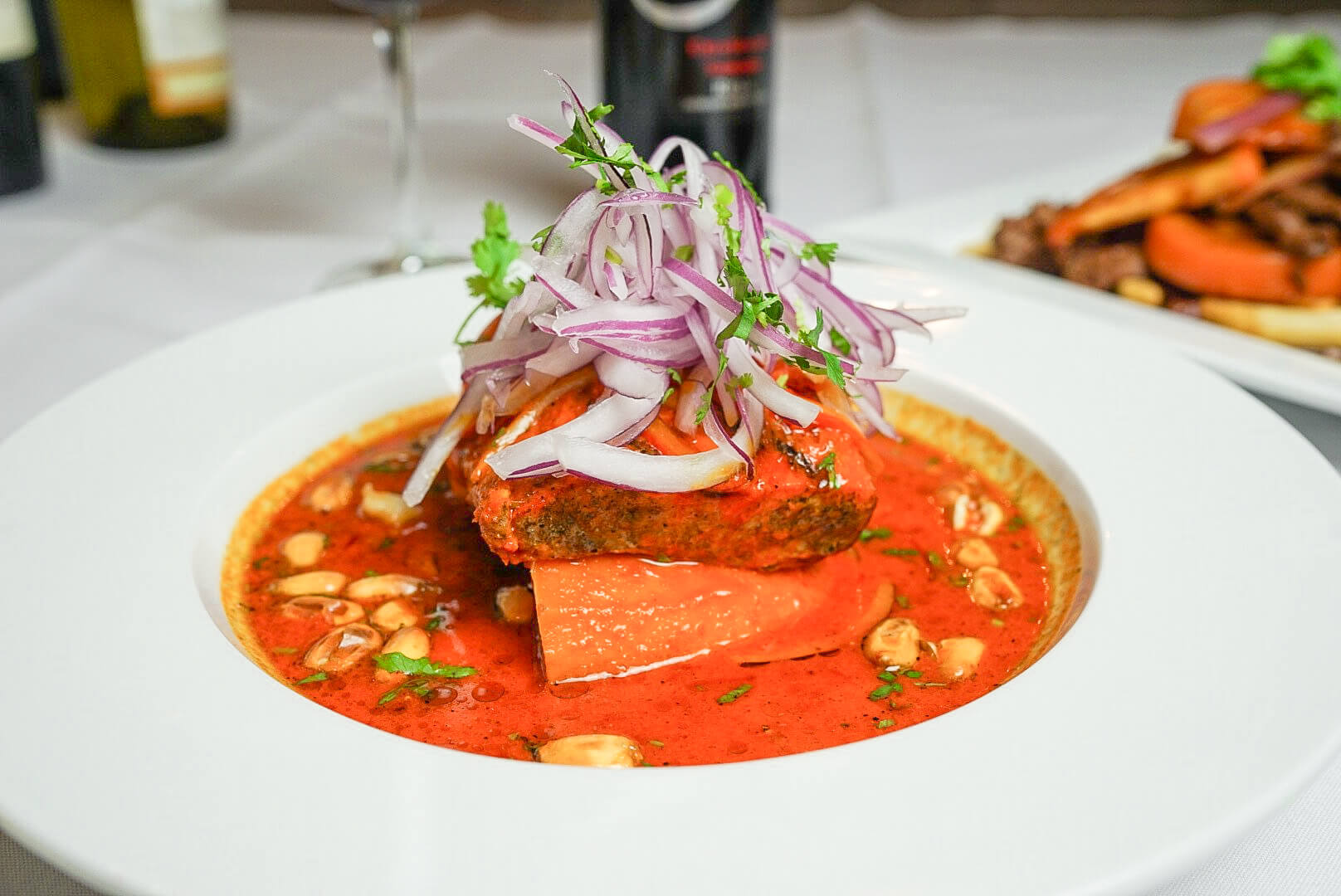 A plate of food with meat and sauce on it.