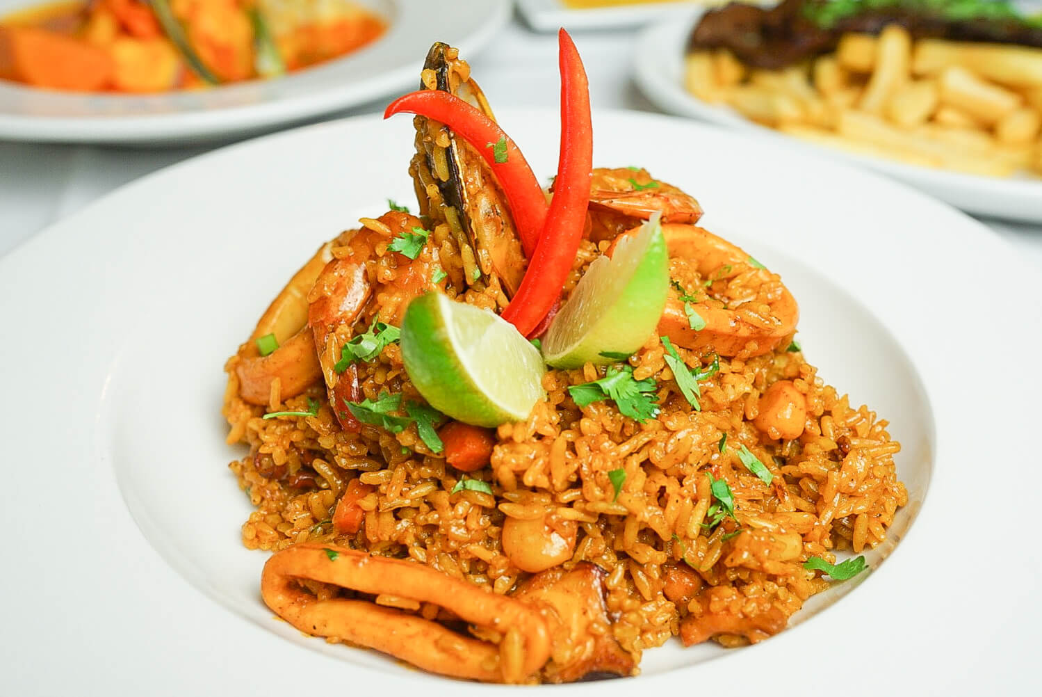 A plate of food with rice and vegetables on it.