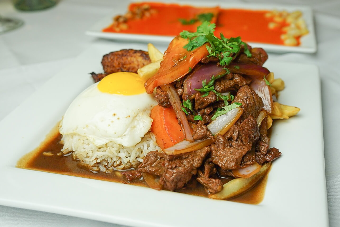 A plate of food with rice and meat.